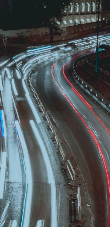Image time lapse photography of cars on road during night time