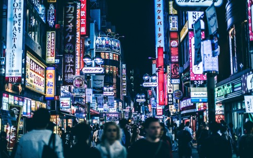 Image people walking on street during night time