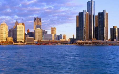 Image city skyline across body of water during daytime