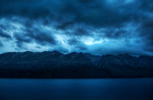 Image black and white mountains under gray clouds