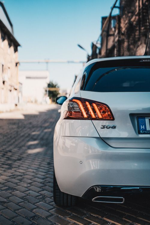 white car on road during daytime