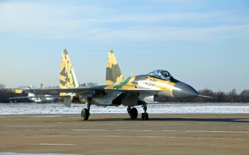 Image two fighter planes on the field during daytime