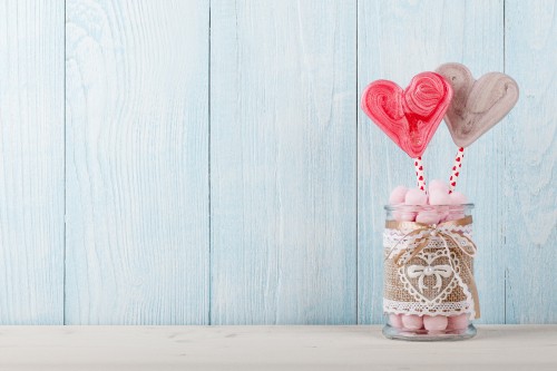 Image red heart balloon on brown wooden table