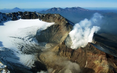 Image aerial view of mountain covered with snow during daytime