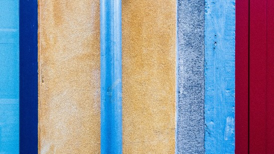 Image blue metal rod on brown concrete wall