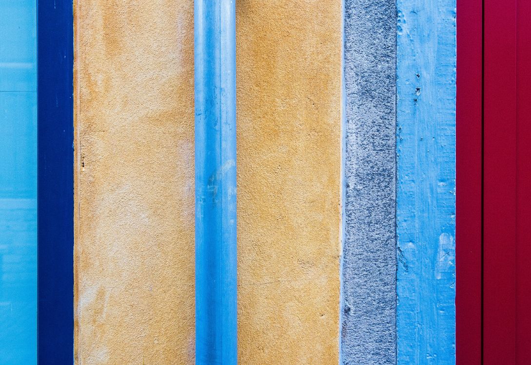 blue metal rod on brown concrete wall