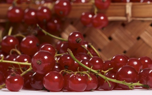 Image red cherries on brown wooden table