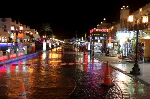 Image people walking on street during night time