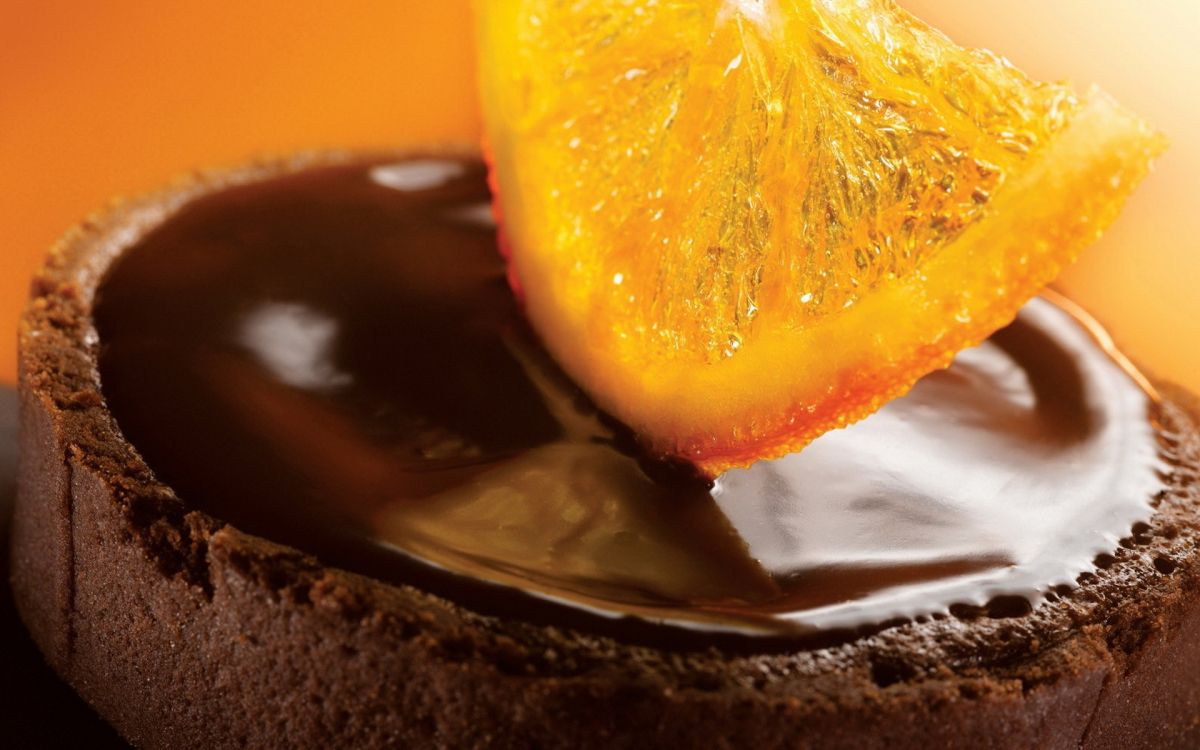 yellow fruit on brown chocolate cake