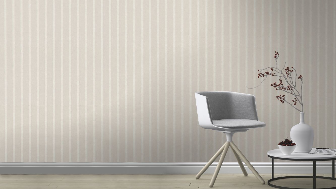 gray and white chair beside white wall