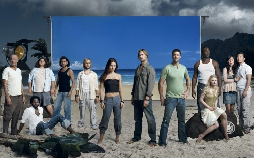 Image 4 men and 2 women standing on beach shore during daytime