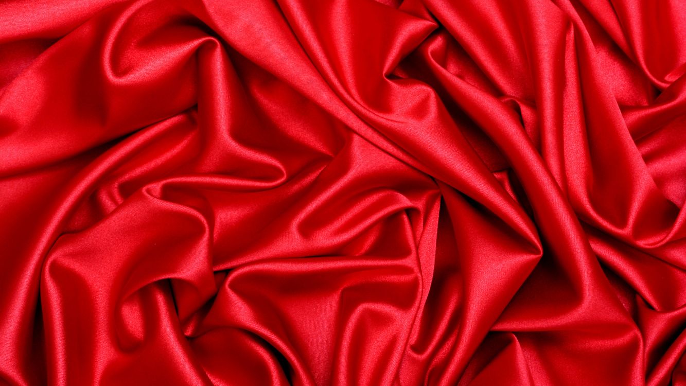 red textile on white textile