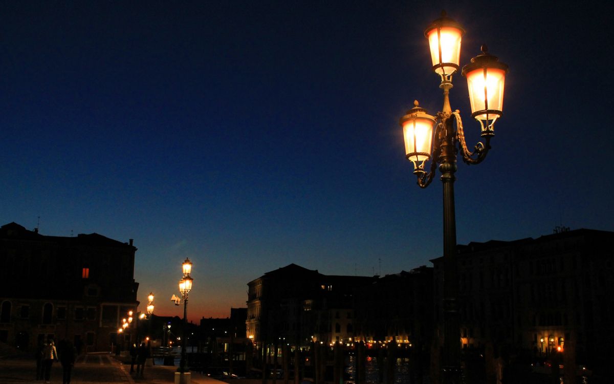 black street light turned on during night time