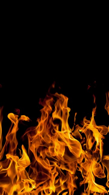 Image orange fire in black background