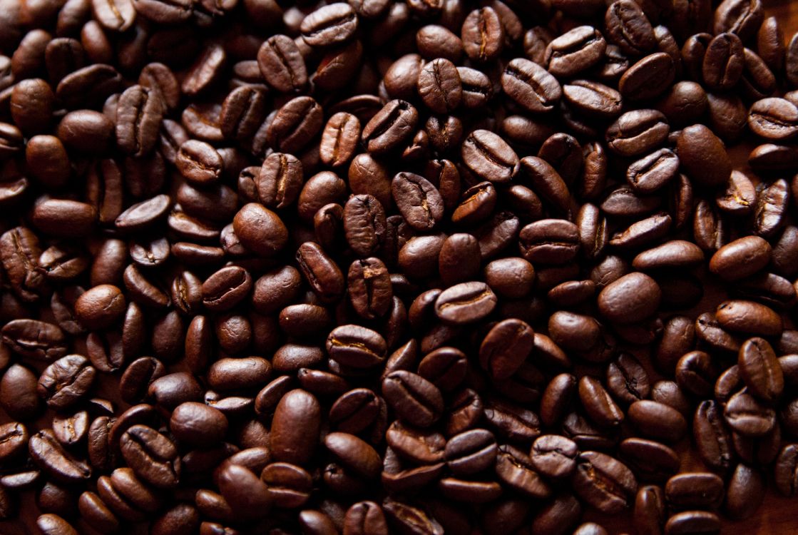 brown coffee beans on brown wooden table