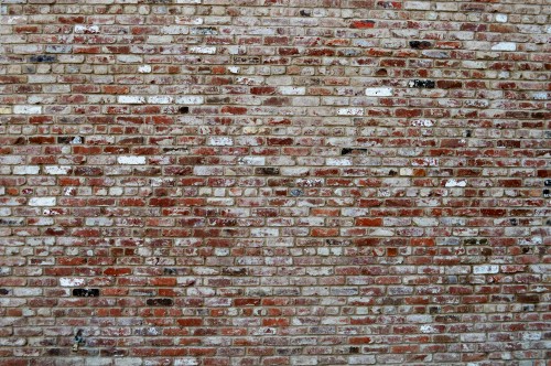 Image brown and black brick wall