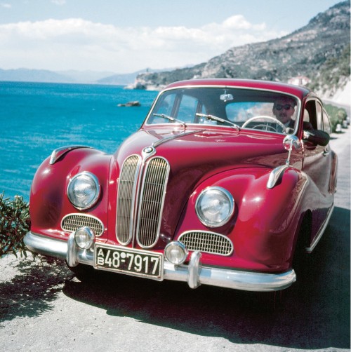 Image red classic car on beach during daytime