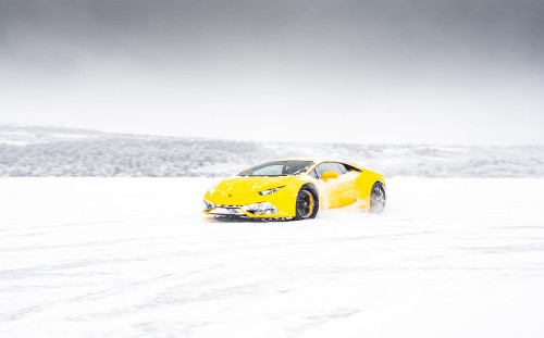 Image yellow ferrari 458 italia on snow covered ground