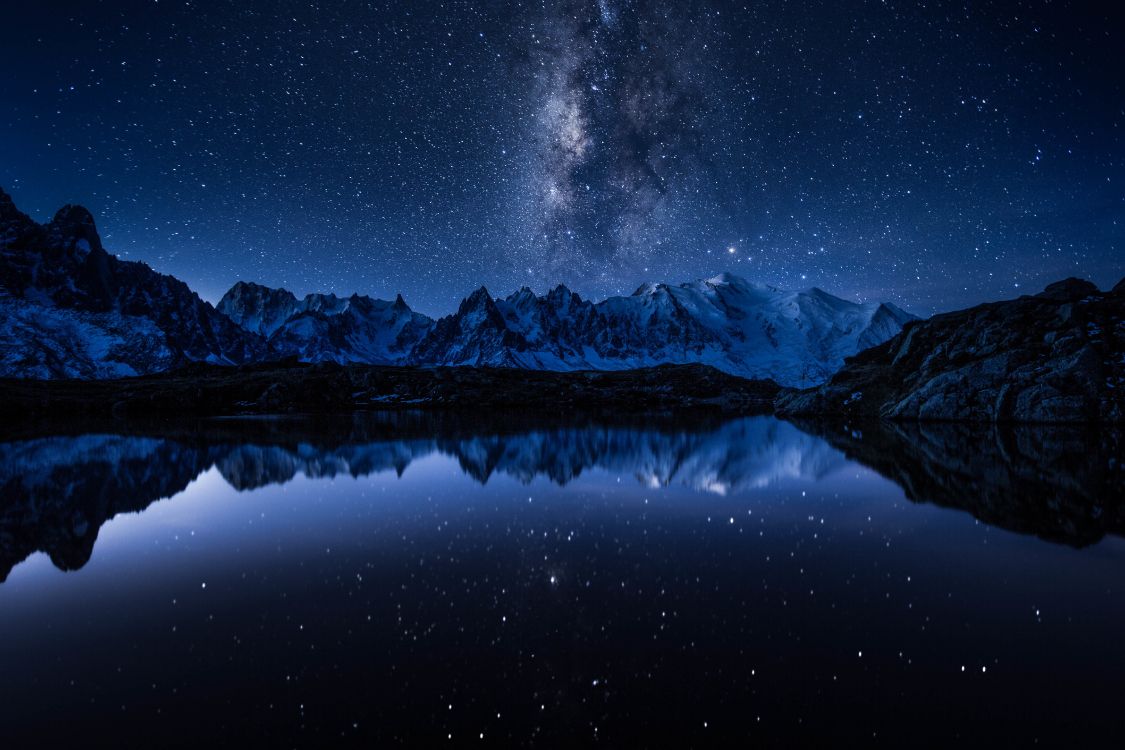 Snow Covered Mountain During Night Time. Wallpaper in 5760x3840 Resolution