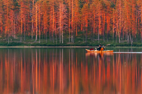 Image person riding on boat on lake during daytime