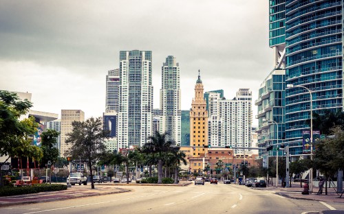 Image people walking on sidewalk near high rise buildings during daytime