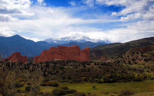 Image brown rocky mountain under white clouds during daytime