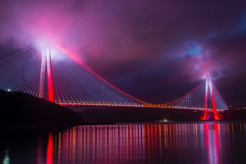 Image bridge with lights during night time