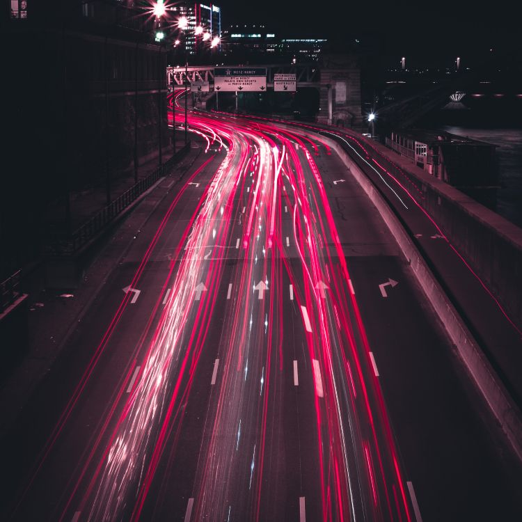 time lapse photography of cars on road during night time