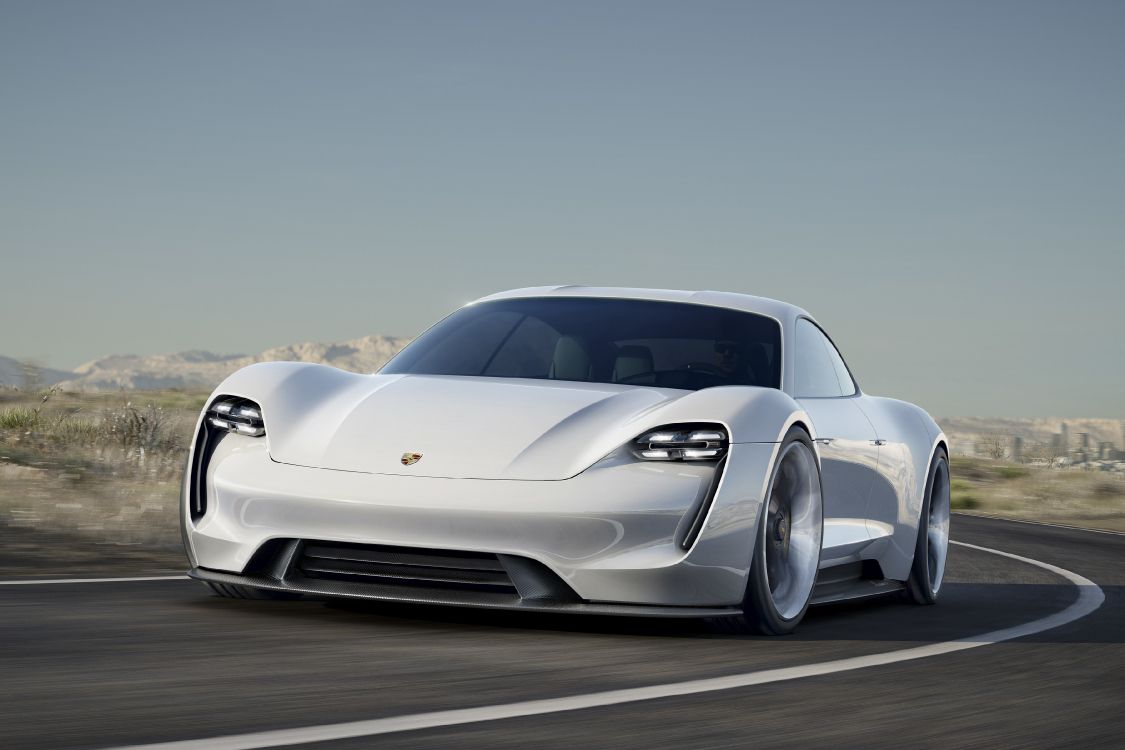 white porsche 911 on road during daytime