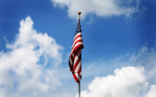 Image us a flag under blue sky during daytime