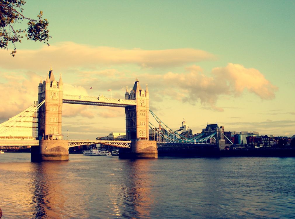 bridge over river during sunset