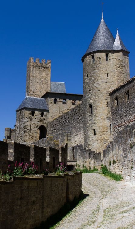 grey concrete castle under blue sky during daytime