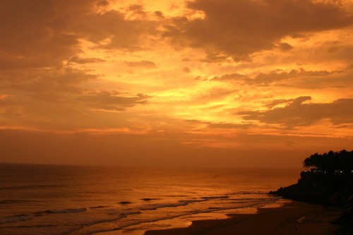 Image body of water under cloudy sky during sunset