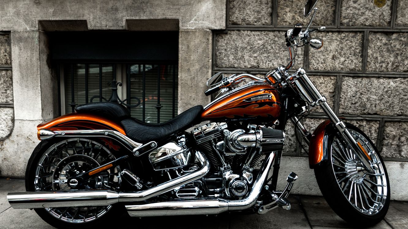 orange and black cruiser motorcycle