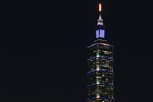 Image black and yellow high rise building during night time