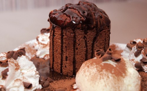 Image chocolate cake with chocolate syrup on top