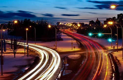 Image time lapse photography of cars on road during night time