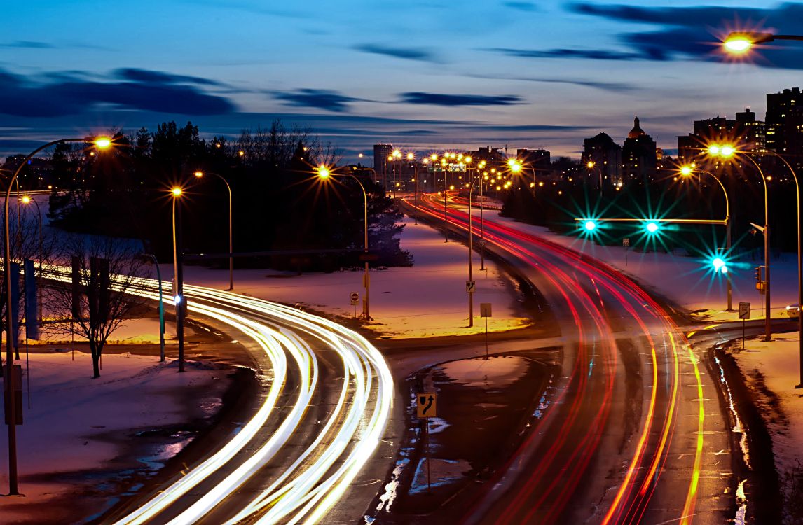 time lapse photography of cars on road during night time