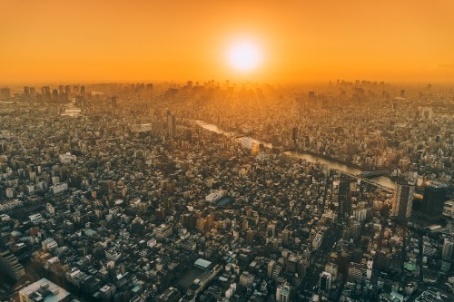 Image aerial view of city during sunset