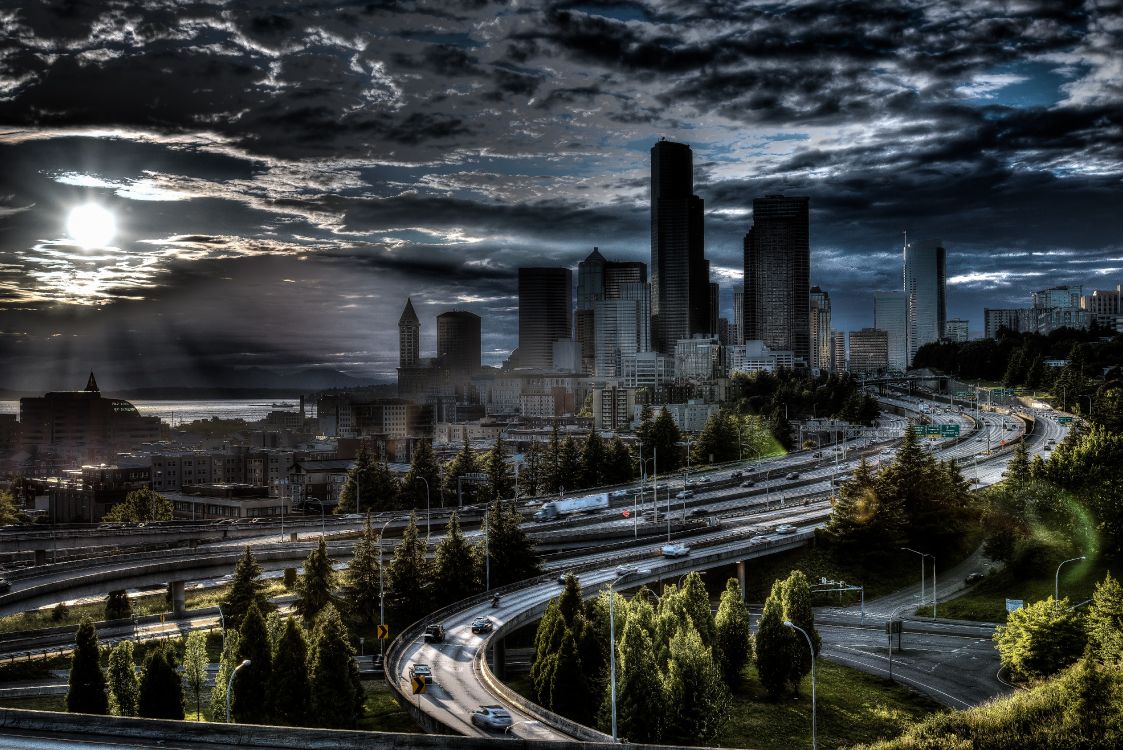 city buildings under gray clouds during daytime