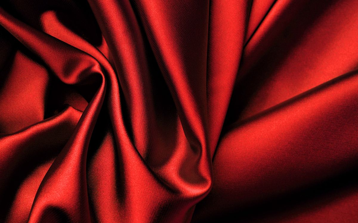 red textile in close up photography