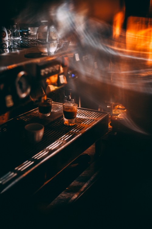 Image time lapse photography of clear drinking glass on brown wooden table