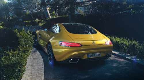 Image yellow porsche 911 parked on gray concrete pavement