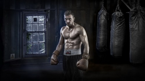 Image topless man in black pants and boxing gloves