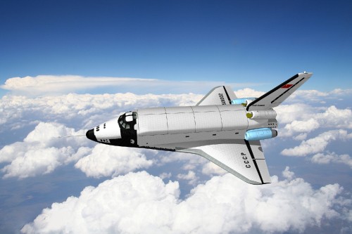 Image white and black passenger plane under blue sky during daytime