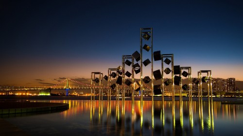 Image white and brown building near body of water during night time