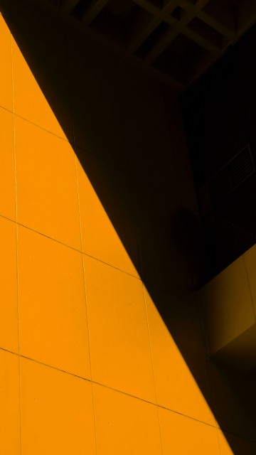 Image yellow floor tiles near white wall