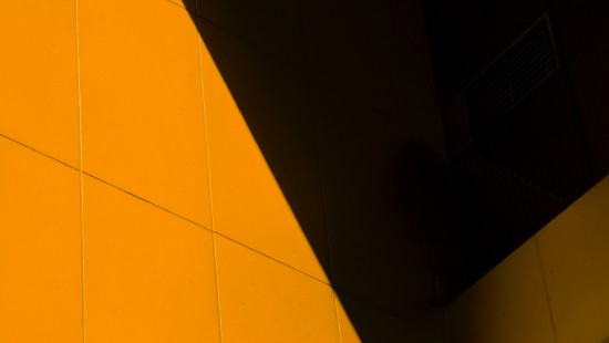 Image yellow floor tiles near white wall