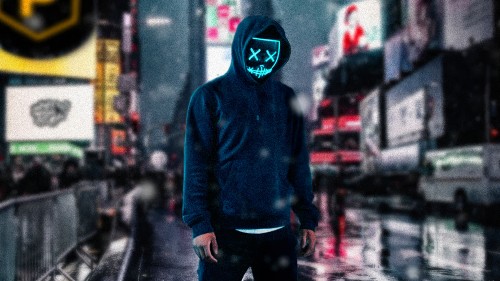 Image man in blue hoodie and black pants wearing black mask standing on street during daytime