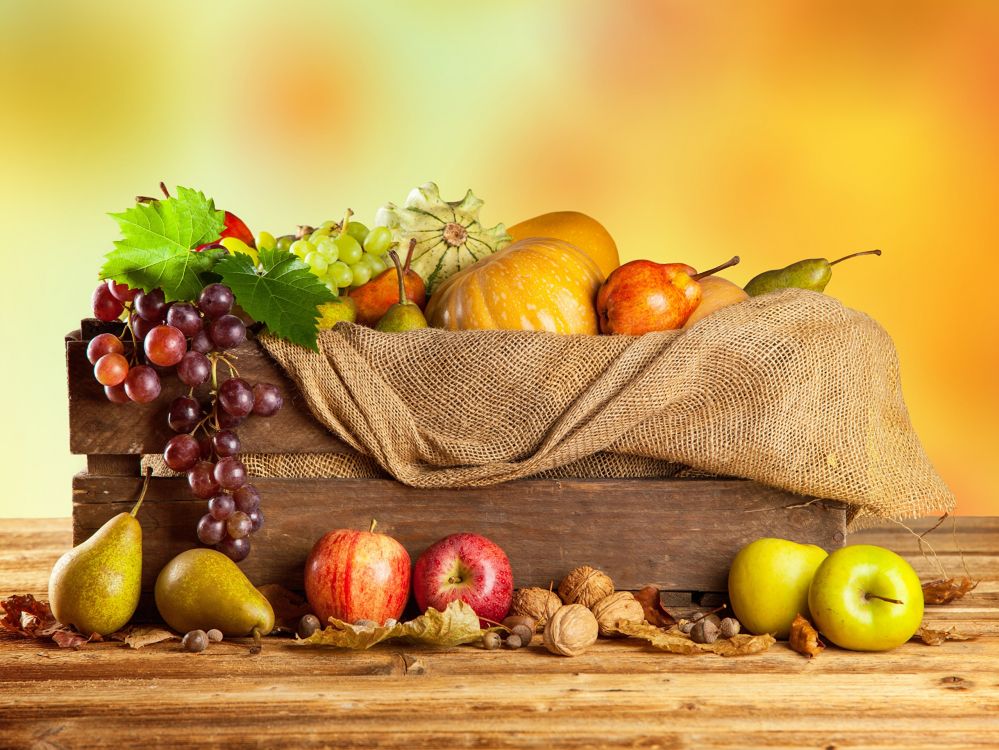 green and red apples on brown basket